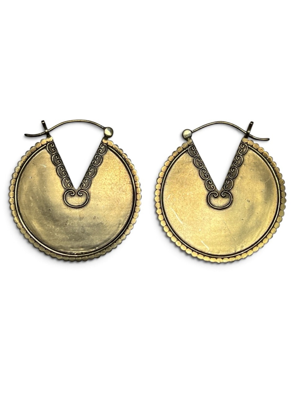Large statement ear weights in antiqued brass with an ornate shield-style design